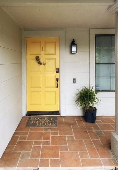 Welcoming front door of a home with a mat