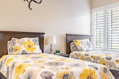 A cozy shared bedroom with two beds