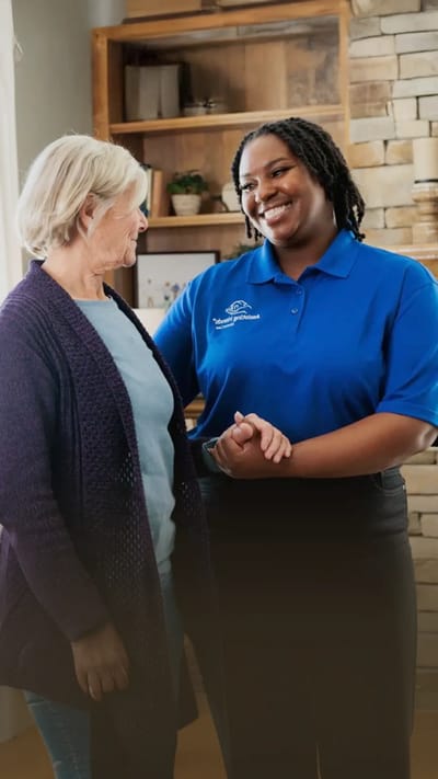 Staff member interacting with a resident in a common area