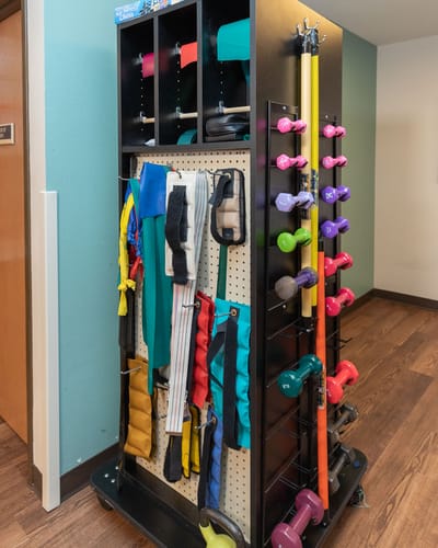 A fitness equipment rack in a rehabilitation room