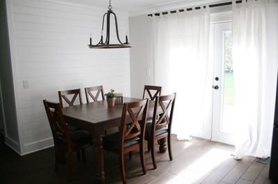 Bright dining room area with a wooden table