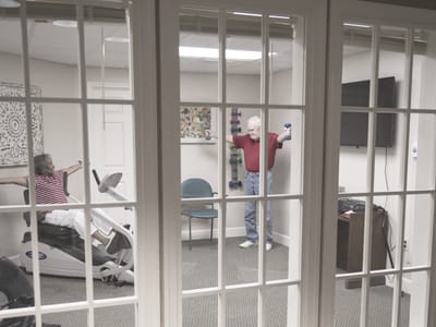 Residents exercising in an activity room