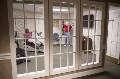 Residents engaging in physical activity in a fitness room