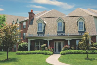 Exterior view of the Bridgeway Pointe building with landscaping