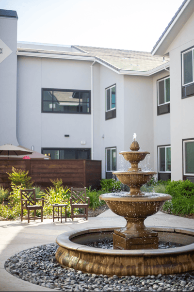Beautiful outdoor courtyard with a fountain and seating