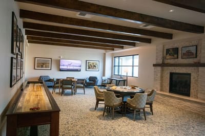 Interior view of a common area with seating and a fireplace