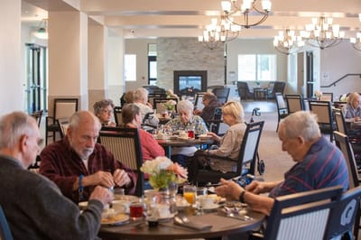 Residents enjoying a meal in the dining room