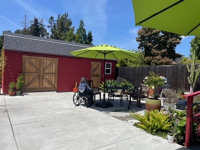 Resident in a wheelchair enjoying an outdoor space