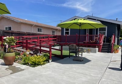 Outdoor patio area with accessible ramp and seating