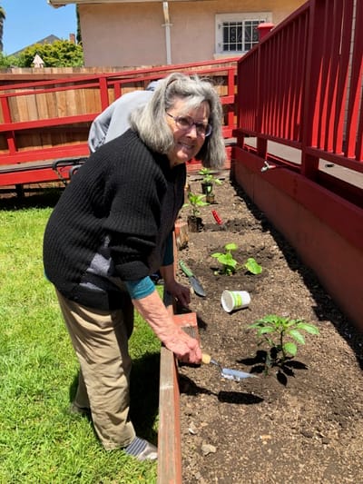Resident gardening in an outdoor space
