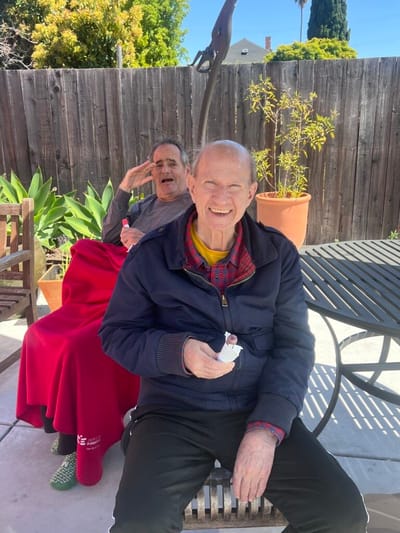 Two residents enjoying ice cream outdoors