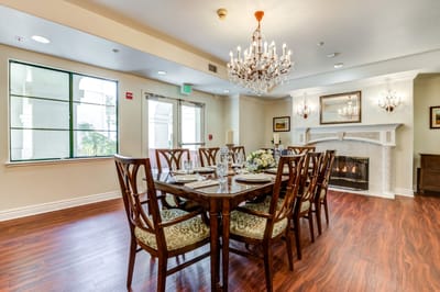 Elegant dining room with a chandelier and table set