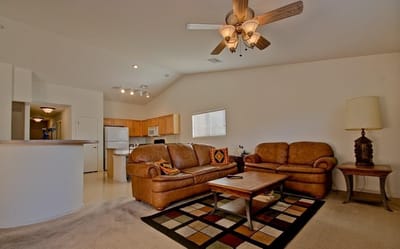 Cozy living room area with furniture and kitchen view