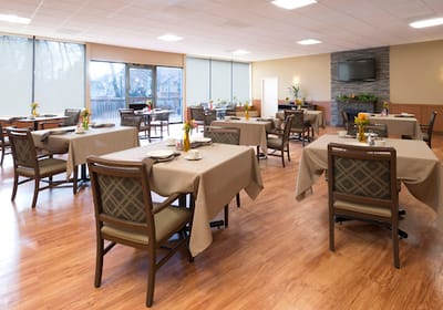 Bright dining room with tables set for meals