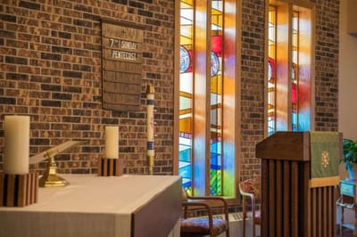 Interior space with stained glass windows and altar