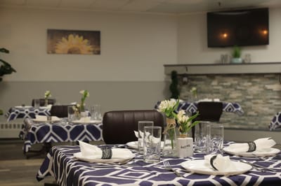 Dining area set up with elegant tables and decorations