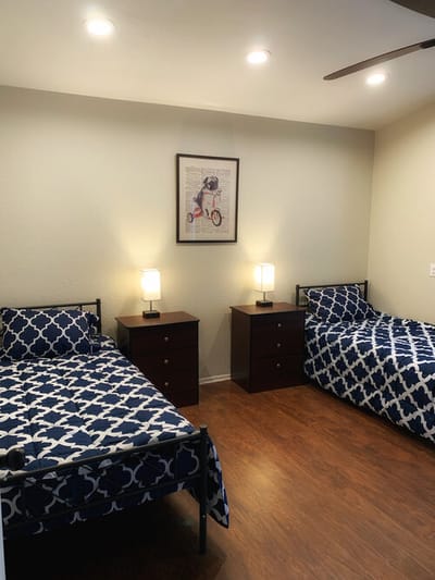 Cozy shared bedroom with two beds and bedside tables
