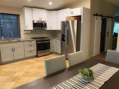 A modern kitchen layout with dining area