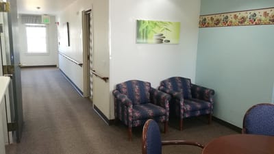 Interior hallway with chairs and plants