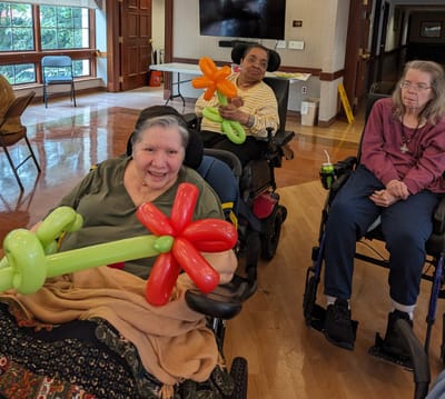 Residents participating in a balloon activity