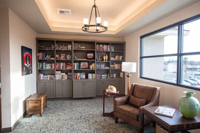 Cozy common area with bookshelves and seating