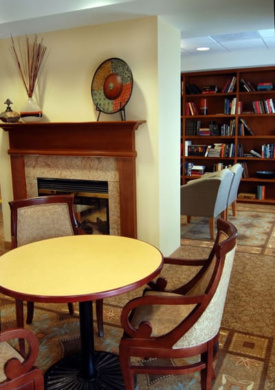Cozy common area with bookshelves and seating