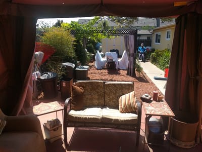 Outdoor seating area with residents and tables