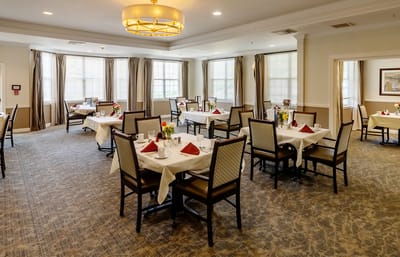 Dining room with tables set for a meal