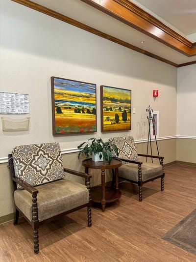 Cozy interior common area with seating and artwork