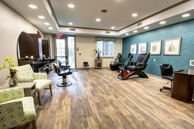 Brightly lit hair salon interior with styling chairs