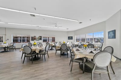 Bright dining room with tables set for dining