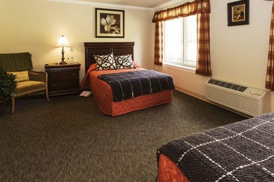 Cozy interior of a resident room with two beds