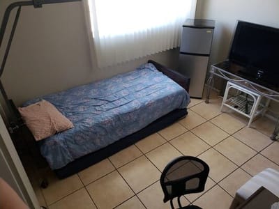 Private resident room with a bed and amenities