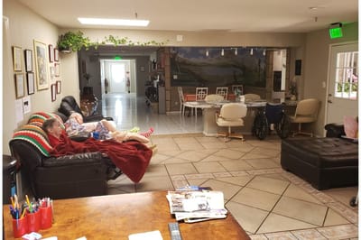 Residents relaxing in a common area of the facility