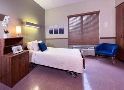 Cozy resident room with a bed and decor