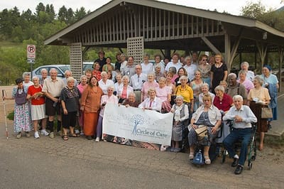 Group photo of residents and staff at Circle of Care