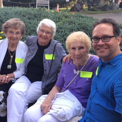 Residents smiling and enjoying each other's company outdoors