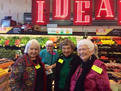 Group of smiling senior women enjoying shopping together