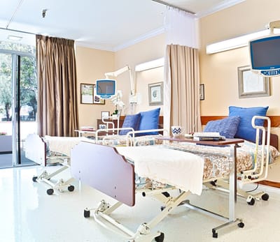 Bright interior of a resident room with two beds
