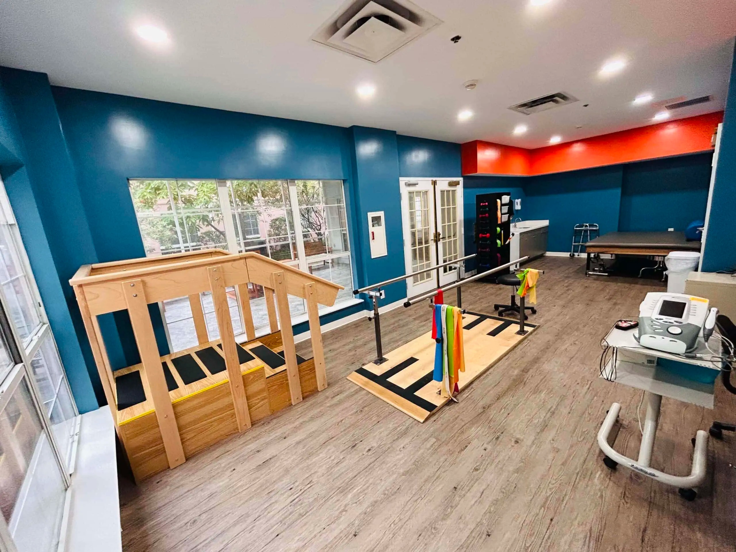 Physical therapy room with exercise equipment