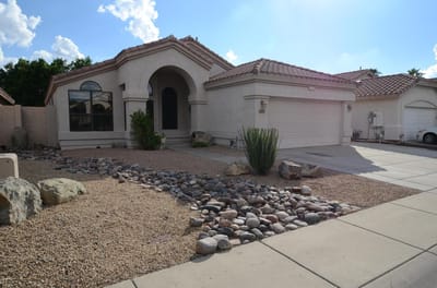 Exterior view of a residential building with landscaping