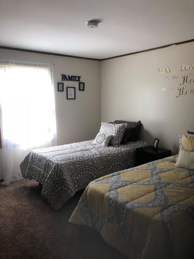 Private resident bedroom with two beds and decor