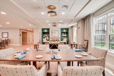 Dining area with a well-set table and decorative walls