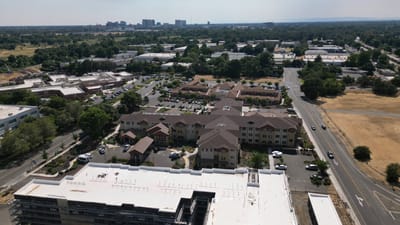 Aerial view of The Woodlake Senior Living facility and surrounding area