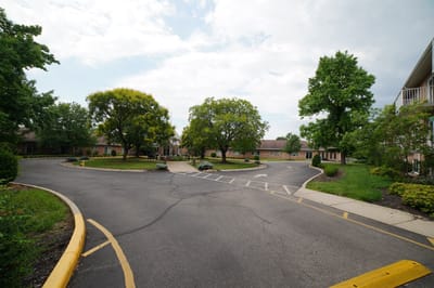 Landscape view of the facility's outdoor area with trees