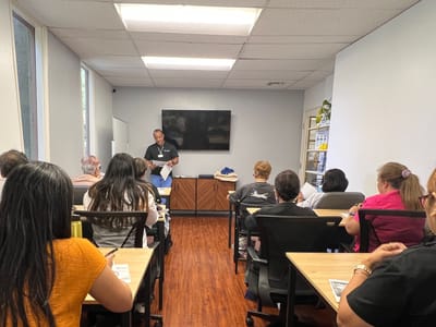 Residents and staff in a training session in a classroom setting