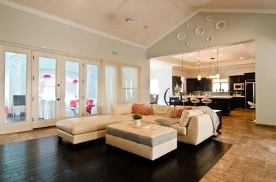 East Valley Mansion Assisted Living, assisted living in Queen Creek, AZ — Modern interior living space with sectional sofa and kitchen