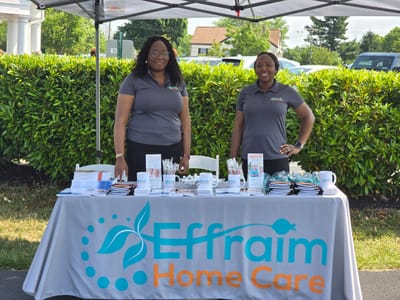 Staff members at an outdoor information booth