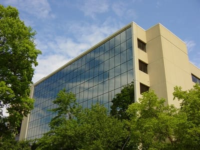 Exterior view of a modern building surrounded by trees