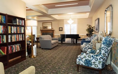 Cozy interior common area with seating and piano